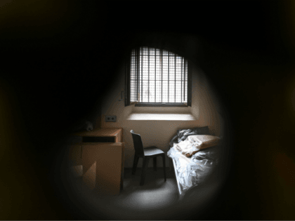 A cell of the preventing radicalisation district (QPR) is pictured through the peephole on