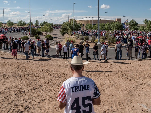 RIO RANCHO, NM - SEPTEMBER 16: People walk to the entrance line for U.S. President Donald