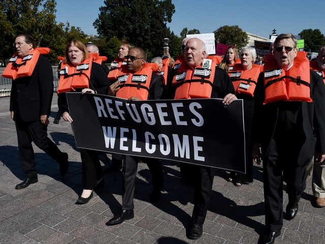 Activists from Amnesty International , America's Voice, the Council on American-Islamic Relations (CAIR) and Church World Service (CWS) hold a civil disobedience protest against "the decimation of the U.S. refugee resettlement program " in front of the US Capitol on October 15, 2019 in Washington, DC. (Photo by Olivier Douliery / AFP) (Photo by OLIVIER DOULIERY/AFP via Getty Images)