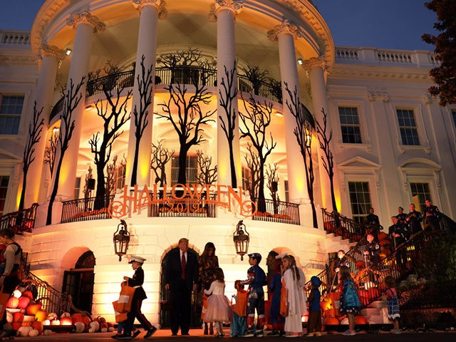 WASHINGTON, DC - OCTOBER 28: U.S. President Donald Trump and first lady Melania Trump hand out candy to children as they trick-or-treat during a Halloween at the White House event at the South Portico of the White House October 28, 2019 in Washington, DC. (Photo by Alex Wong/Getty Images)
