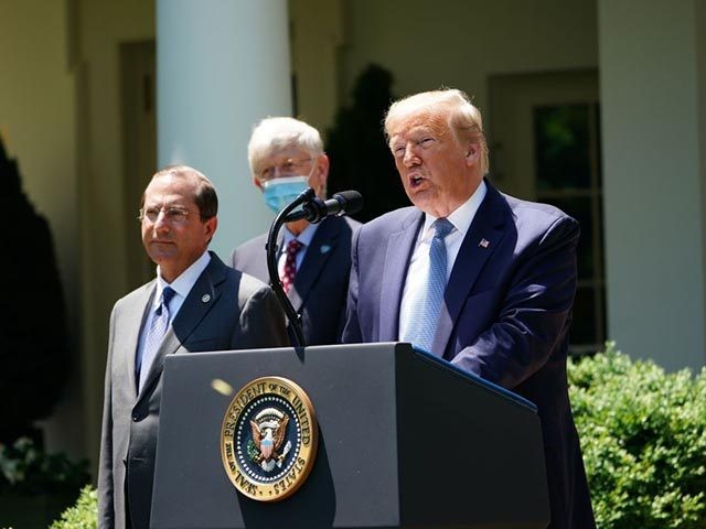 US President Donald Trump, with US Secretary of Health and Human Services Alex Azar (L), speaks on vaccine development on May 15, 2020, in the Rose Garden of the White House in Washington, DC. (Photo by MANDEL NGAN / AFP) (Photo by MANDEL NGAN/AFP via Getty Images)