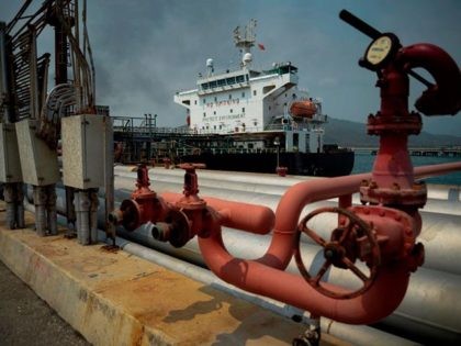 The Iranian-flagged oil tanker Fortune is docked at the El Palito refinery after its arrival to Puerto Cabello in the northern state of Carabobo, Venezuela, on May 25, 2020. - The first of five Iranian tankers carrying much-needed gasoline and oil derivatives docked in Venezuela on Monday, Caracas announced amid …