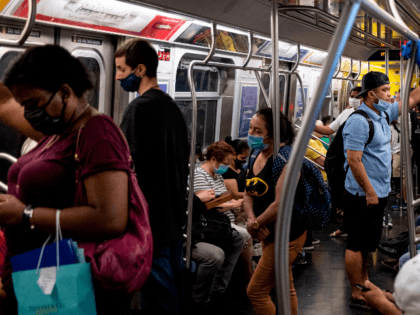 People stand in a subway train during rush hour amid the coronavirus pandemic on July 16, 2020 in New York City. (Photo by Johannes EISELE / AFP) (Photo by JOHANNES EISELE/AFP via Getty Images)