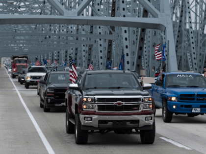 CINCINNATI, OH - SEPTEMBER 12: A caravan of cars travel eastward on I-275 in solidarity with President Donald Trump flying 'Trump 2020' and American flags. Trump supporters gathered at various points along the I-275 Beltway and drove in a parade along the interstate circling Cincinnati. (Photo by Matthew Hatcher/Getty Images)
