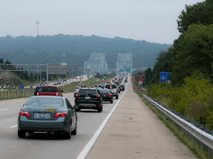 A caravan of cars travel eastward on I-275 in solidarity with President Donald Trump flying 'Trump 2020' and American flags September 12, 2020 in Cincinnati, Ohio. Trump supporters gathered at various points along the I-275 Beltway and drove in a parade along the interstate circling Cincinnati. (Photo by Matthew Hatcher/Getty …