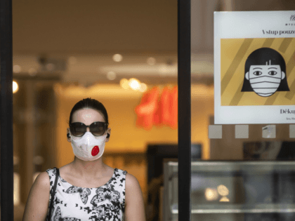 PRAGUE, CZECH REPUBLIC - SEPTEMBER 16: A woman wearing a face mask leaves the shopping mal