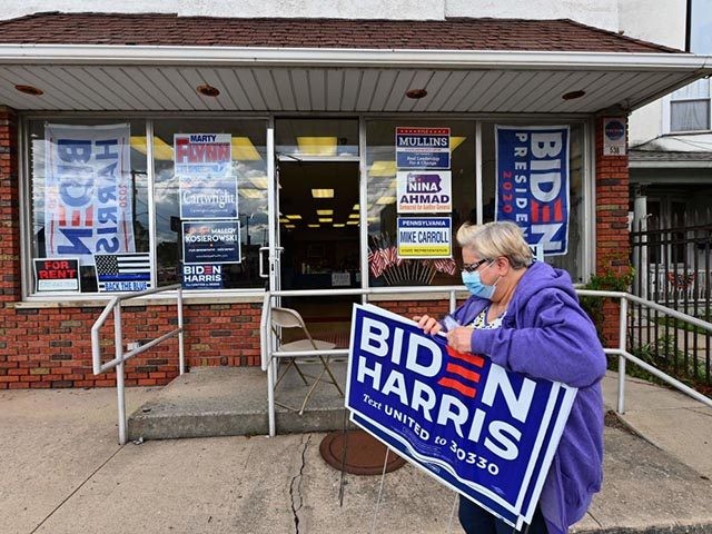 A supporter of US Democratic presidential candidate Joe Biden and his vice presidential running mate, US Senator Kamala Harris leaves the Lackawanna County Democratic Committee headquarters on September 30, 2020 in Peckville, Pennsylvania. (Photo by Angela Weiss / AFP) (Photo by ANGELA WEISS/AFP via Getty Images)