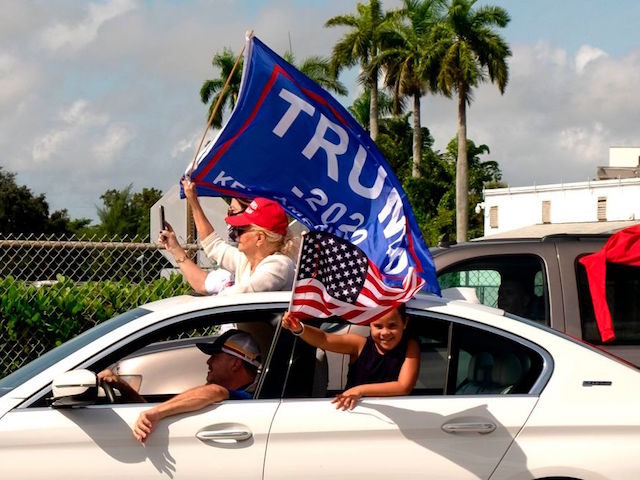 Supporters of President Donald Trump attend a mass caravan named 'Anticommunist Caravan' in Miami, Florida October 10, 2020. - Hundreds of cars participated October 10, 2020 in the anticommunist caravan organized by Cuban exiles in Miami. (Photo by GASTON DE CARDENAS / AFP) (Photo by GASTON DE CARDENAS/AFP via Getty …