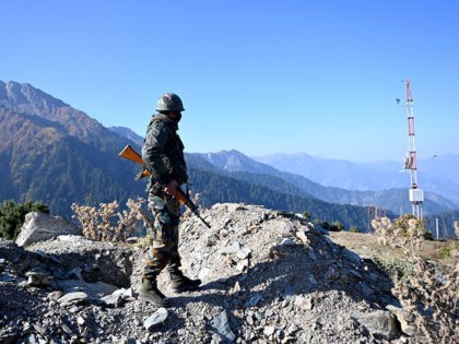 An Indian Army soldier stands guard near Nastachun pass, also known as Sadhana pass, about 8 Km from the Line of Control (LOC) in the district of Kupwara on October 14, 2020. (Photo by Money SHARMA / AFP) (Photo by MONEY SHARMA/AFP via Getty Images)