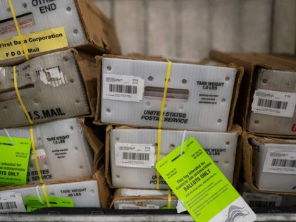PORTLAND, OR - OCTOBER 14: Pallets filled with Washington and Oregon mail-in ballots fill an unloading area at a U.S. Postal Service (USPS) processing and distribution center on October 14, 2020 in Portland, Oregon. USPS workers in Portland began processing and mailing about 1.5 million ballots this week ahead of …