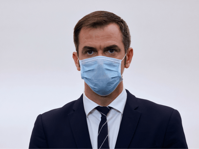 French Health Minister Olivier Veran wears a face mask during a press conference to presen