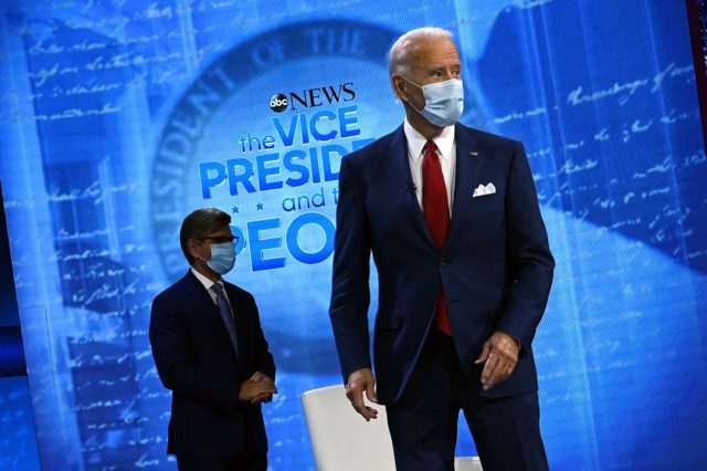 Democratic Presidential candidate and former US Vice President Joe Biden (R) and moderator George Stephanopoulos arrive for an ABC News town hall event at the National Constitution Center in Philadelphia on October 15, 2020. (Photo by JIM WATSON / AFP) (Photo by JIM WATSON/AFP via Getty Images)