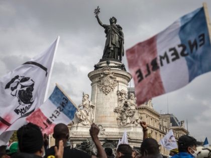PARIS, FRANCE - OCTOBER 17: Supporters and migrants converge from all over France at the Place de la Republique for a mass protest calling for migrant's administrative rights, housing for all and the closure of administrative detention centers on October 17, 2020 in Paris, France. For several months undocumented migrants …