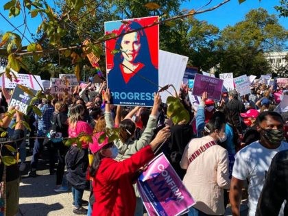 Demonstrators march past the Supreme Court in the nationwide Women's March on October 17, 2020, in Washington, DC. (Photo by Daniel SLIM / AFP) (Photo by DANIEL SLIM/AFP via Getty Images)