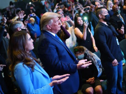 Hope Hicks (L), senior adviser to the president, attends services with U.S. President Donald Trump at the International Church of Las Vegas in Las Vegas, Nevada, on October 18, 2020. - President Donald Trump and rival Joe Biden hit the ground Sunday in the swing states that will decide the …