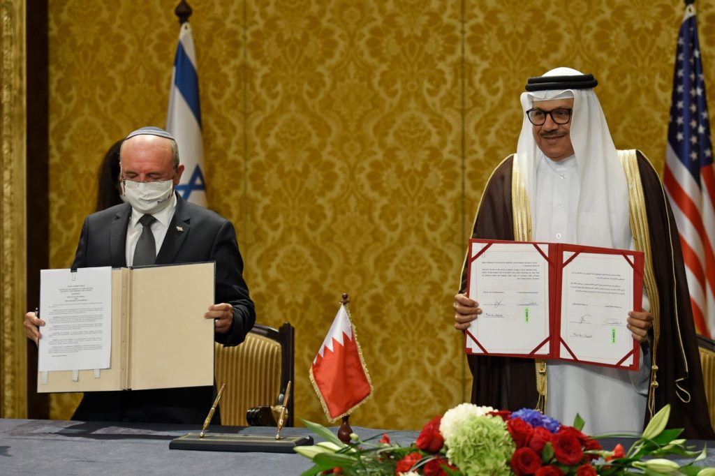 Bahraini Foreign Minister Abdullatif bin Rashid Al-Zayani (R) and head of the Israeli delegation National Security Advisor Meir Ben Shabbat sign agreements during a ceremony in Bahrain's capital Manama, on October 18, 2020. - Israel and Bahrain cemented a deal officially establishing relations and signed several memorandums of understanding, further opening up the wealthy Gulf region to the Jewish state. (Photo by Mazen Mahdi / AFP) (Photo by MAZEN MAHDI/AFP via Getty Images)