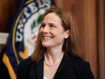 WASHINGTON, DC - OCTOBER 21: Supreme Court nominee Judge Amy Coney Barrett listens during a meeting with U.S. Sen. John Barasso (R-WY) on October 21, 2020 in Washington, DC. President Donald Trump nominated Barrett to replace Justice Ruth Bader Ginsburg after her death. (Photo by Ken Cedeno-Pool/Getty Images)