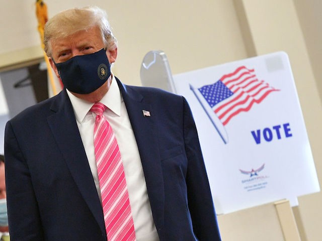 US President Donald Trump leaves the polling station after casting his ballot at the Palm Beach County Public Library, during early voting for the November 3 election, in West Palm Beach, Florida, on October 24, 2020.