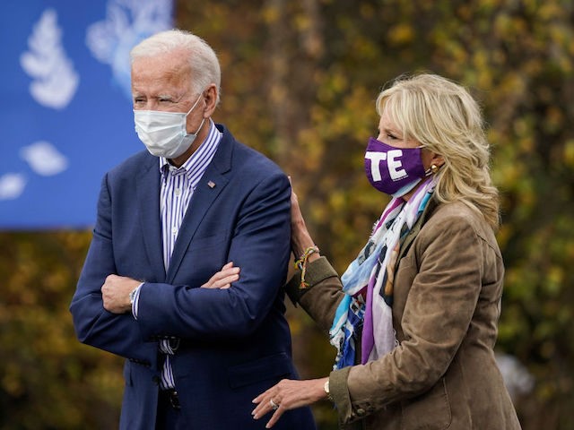 BRISTOL, PA - OCTOBER 24: Democratic presidential nominee Joe Biden stands with his wife Dr. Jill Biden before speaking at a drive-in campaign rally at Bucks County Community College on October 24, 2020 in Bristol, Pennsylvania. Biden is making two campaign stops in the battleground state of Pennsylvania on Saturday. …