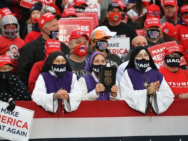 Supporters listen to US President Donald Trump speak during a campaign rally at Pickaway Agriculture and Event Center in Circleville, Ohio on October 24, 2020. (Photo by MANDEL NGAN / AFP) (Photo by MANDEL NGAN/AFP via Getty Images)