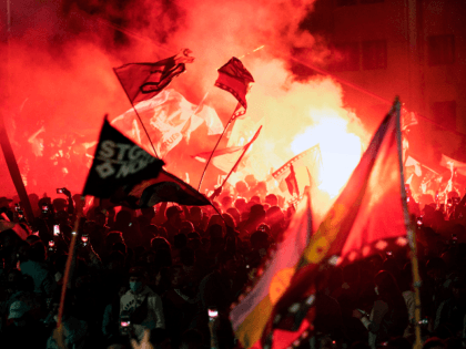 Demonstrators supporting the reform of the Chilean constitution celebrate while waiting fo