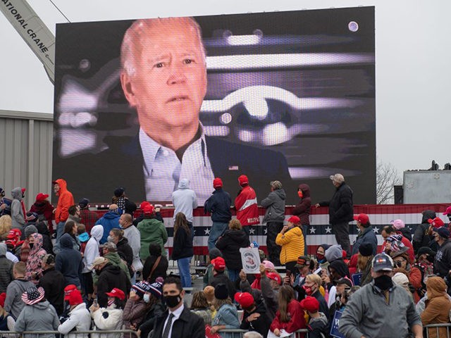 US President Donald Trump plays a video of Democratic presidential candidate former Vice President Joe Biden as he holds a campaign rally at HoverTech International in Allentown, Pennsylvania, October 26, 2020. (Photo by SAUL LOEB / AFP) (Photo by SAUL LOEB/AFP via Getty Images)