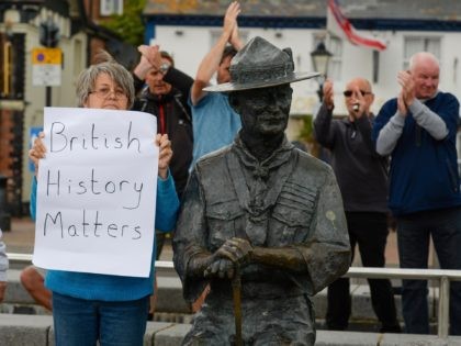 POOLE, ENGLAND - JUNE 11: Locals show their support for the Lord Baden-Powell statue on June 11, 2020 in Poole, United Kingdom. The statue of Robert Baden-Powell on Poole Quay is to be placed into safe storage after campaigners have accused him of racism, homophobia and support for Adolf Hitler. …