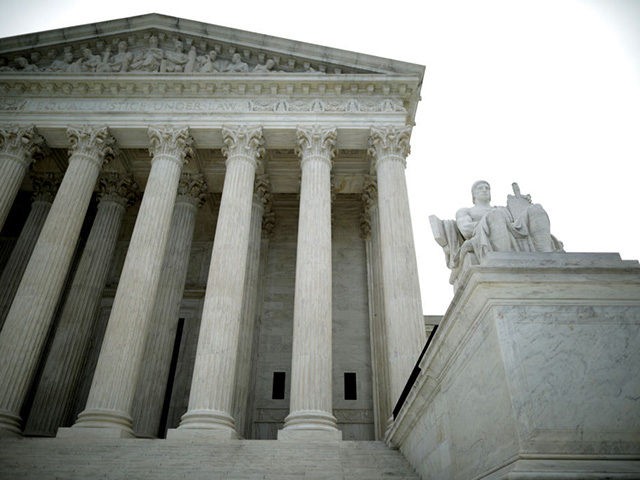 WASHINGTON, DC - JUNE 15: The statue Authority of Law by sculptor James Earle Fraser stands on the steps of the U.S. Supreme Court which ruled that LGBTQ people can not be disciplined or fired based on their sexual orientation June 15, 2020 in Washington, DC. With Chief Justice John …