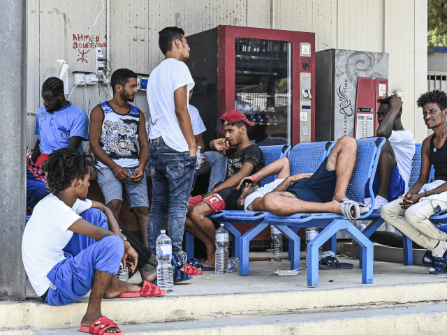 LAMPEDUSA, ITALY - AUGUST 04: Migrants in the Lampedusa hotspot, reportedly collapsing, wa