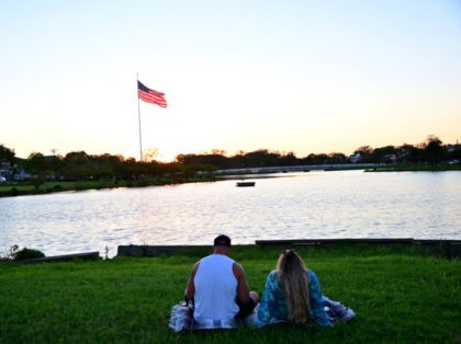 VARIOUS CITIES - SEPTEMBER 05: A couple watches the sunset on September 05, 2020 in Asbur