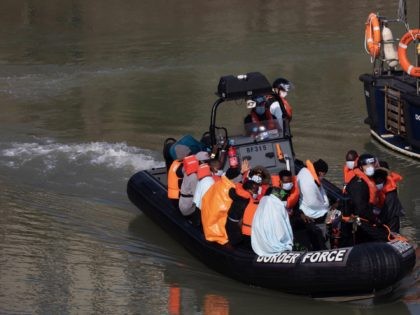 DOVER, ENGLAND - SEPTEMBER 22: Border Force officials unload migrants, that have been inte