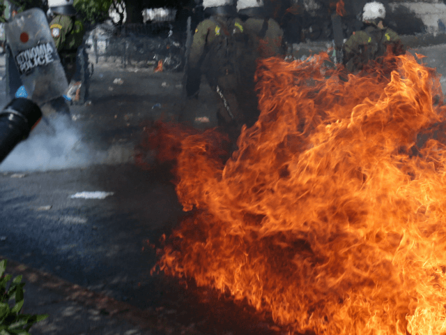 ATHENS, GREECE - OCTOBER 07: Riot police during clashes outside a court, where the trial o