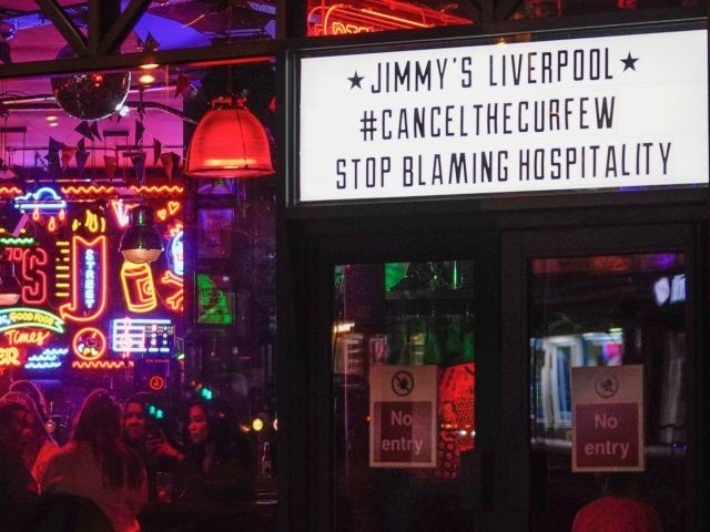 LIVERPOOL, ENGLAND - OCTOBER 13: As revelers enjoy their last night a sign supports cancel