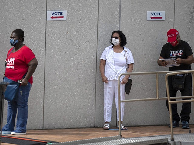 WESTCHESTER, FLORIDA - OCTOBER 19: Voters wait in line, socially distanced from each other, to cast their early ballots at the Westchester Regional Library polling station on October 19, 2020 in Westchester, Florida. The early voting ends on Nov. 1. Voters are casting their ballots for presidential candidates President Donald …