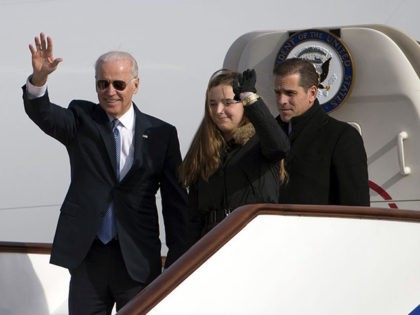 BEIJING, CHINA - DECEMBER 04: U.S. Vice President Joe Biden waves as he walks out of Air Force Two with his granddaughter Finnegan Biden (C) and son Hunter Biden (R) at the airport December 4, 2013 in Beijing, China. Biden is on the first leg of his week-long visit to …