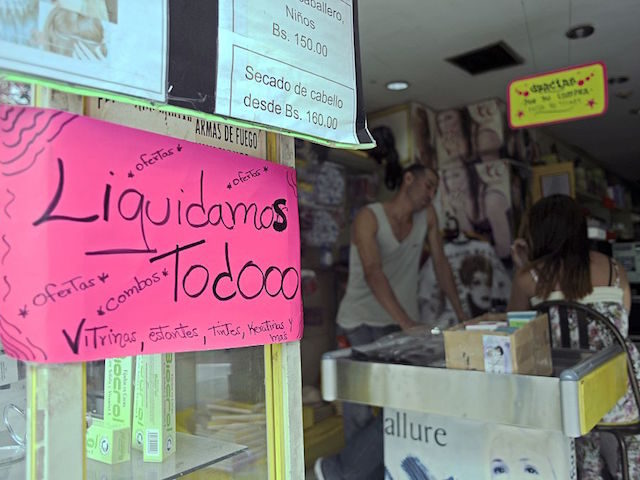 View of a sign at the entrance of a store announcing an all-items sale in Caracas on Janua