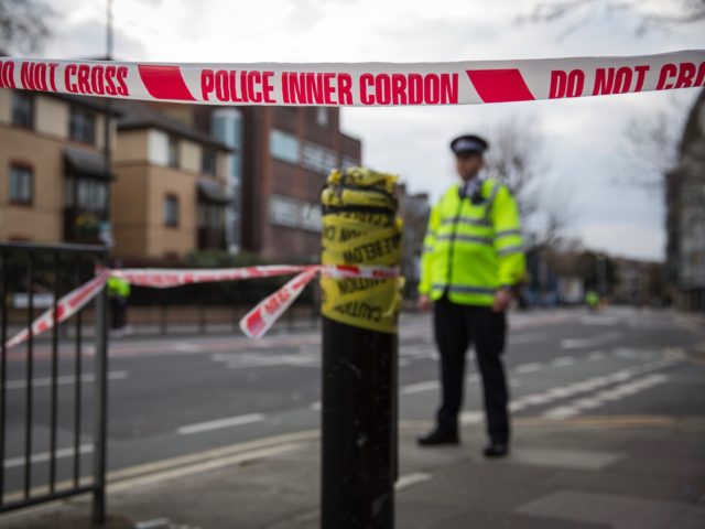 SOUTHWARK, ENGLAND - MARCH 23: Police officers cordon off an area of the site of an unexploded World War Two bomb on March 23, 2015 in Southwark, England. Over 1,000 homes in the south London borough have been evacuated after the 1000lb bomb was found on a building site in …