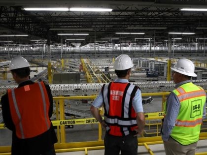 SACRAMENTO, CA - AUGUST 10: Workers view a conveyor belt system that is under construction at a new Amazon fulfillment center on August 10, 2017 in Sacramento, California. Amazon is preparing to open a new 855,000-square-foot warehouse, the tenth in California, by early October and is expected to hire nearly …
