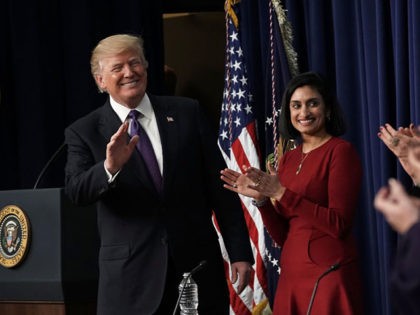 WASHINGTON, DC - JANUARY 16: U.S. President Donald Trump (L) acknowledges the audience as Administrator of the Centers for Medicare and Medicaid Services Seema Verma (2nd L) looks on as he stops by a Conversations with the Women of America panel at the South Court Auditorium of Eisenhower Executive Office …