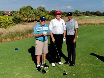 Jack Nicklaus, Donald Trump, and Tiger Woods on the golf course