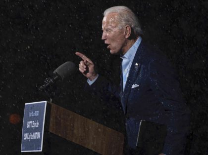 Joe Biden in the rain (Jim Watson / AFP / Getty)