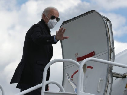 Democratic presidential nominee Joe Biden waves before traveling to Grand Rapids, Michigan