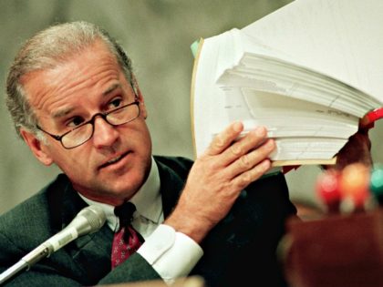 Sen. Joseph Biden, D-Del., holds up copies of a list of FBI files during a hearing of the