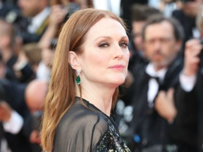 US actress Julianne Moore poses on May 11, 2016 as she arrives for the opening ceremony of the 69th Cannes Film Festival in Cannes, southern France. / AFP / Valery HACHE (Photo credit should read VALERY HACHE/AFP via Getty Images)