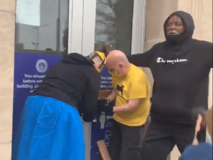 Members of KC Tenants chain the doors of the Jackson County, MO, courthouse closed during an anti-eviction protest. (Video Screenshot/KC Tenants)