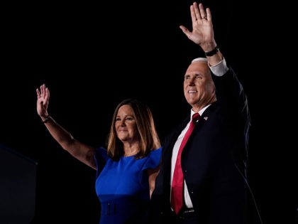 BALTIMORE, MARYLAND - AUGUST 26: Mike Pence stands with his wife Karen Pence before accept