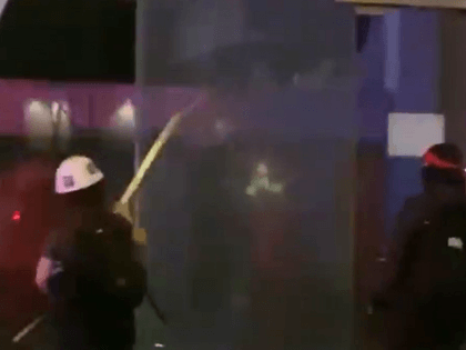 Los Angeles rioters smash windows in the downtown district. (Photo: Twitter video screenshot)