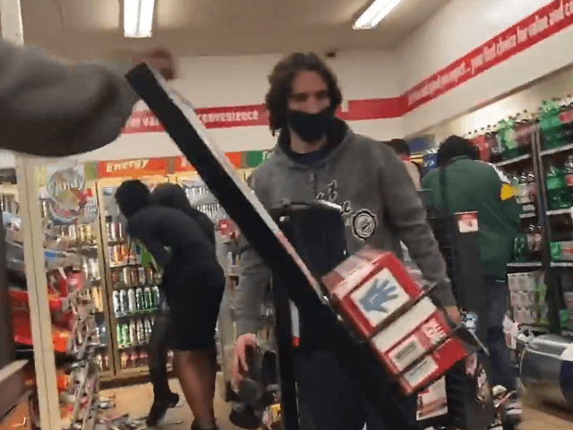 Dozens of "peaceful protesters" loot a Wisconsin convenience store. (Twitter Video Screenshot/Julio Rosas)