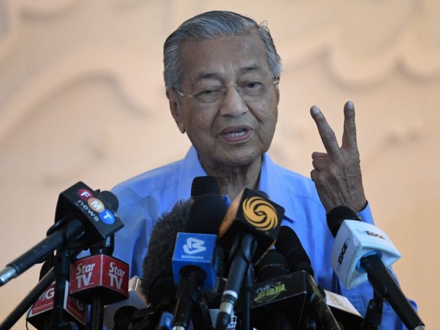 Malaysia's interim Prime Minister Mahathir Mohamad gestures during a press conference in K