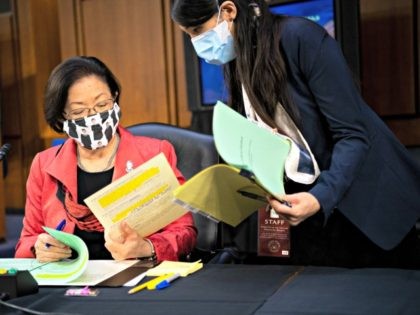 WASHINGTON, DC - OCTOBER 14: U.S. Sen. Mazie Hirono (D-HI) prepares her remarks with an aide during a break after Supreme Court nominee Judge Amy Coney Barrett testified before the Senate Judiciary Committee on the third day of her Supreme Court confirmation hearing on Capitol Hill on October 14, 2020 …